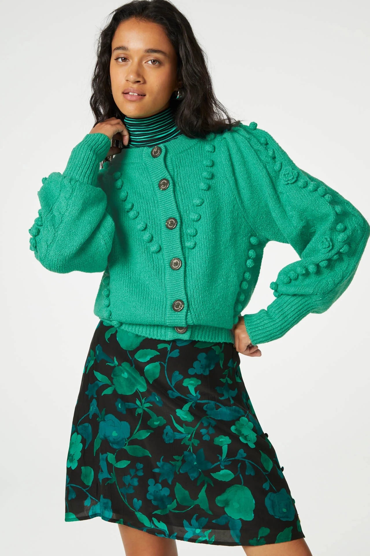 A model wearing a green cardigan and a Fabienne Chapot Lydia Short Skirt - Green Chacha.