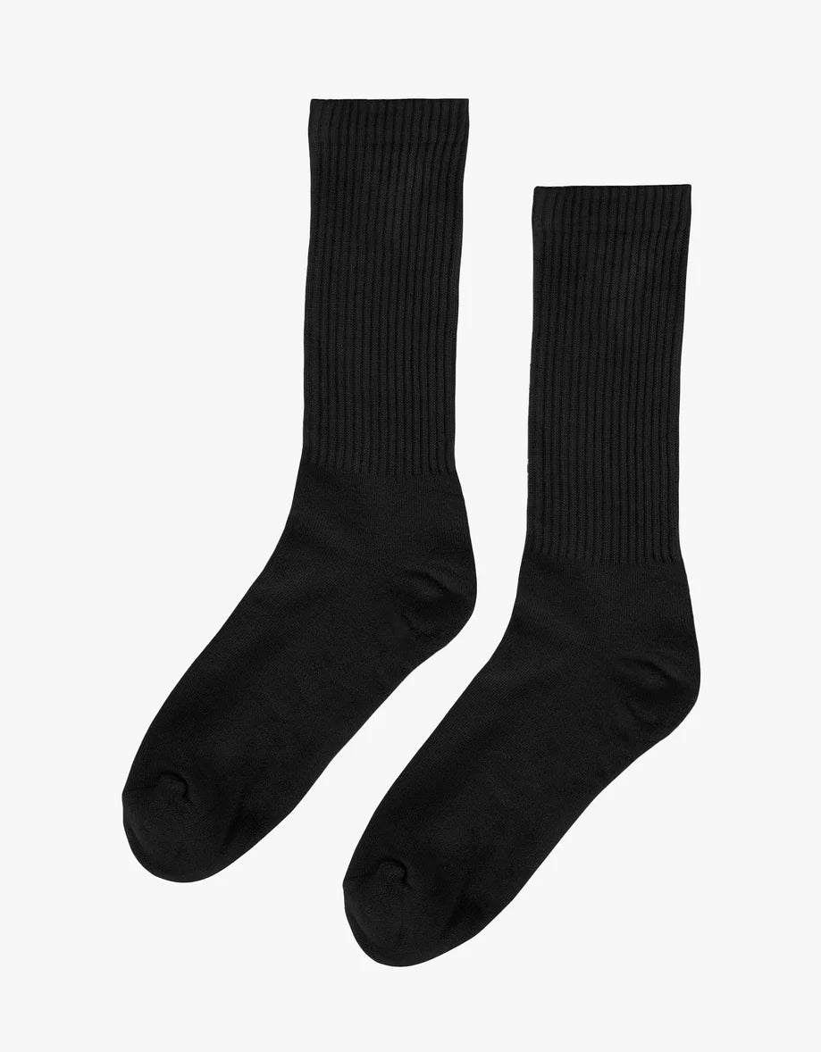 A pair of Colorful Standard Organic Active Sock black socks.