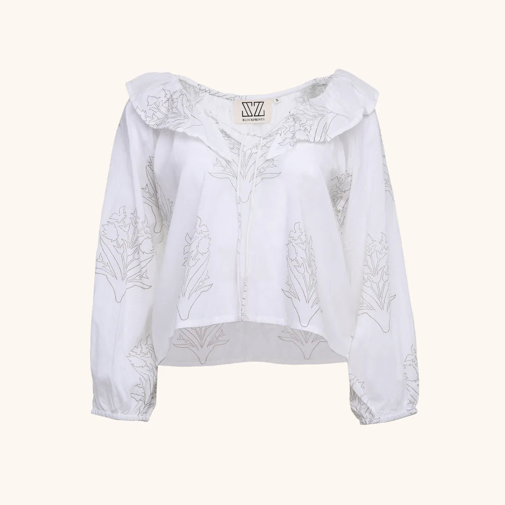 White long sleeve blouse with ruffle collar and gold floral pattern