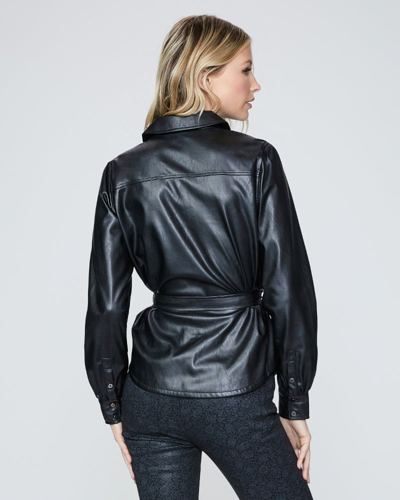The back view of a woman wearing a Paige Belize Shacket - Black.