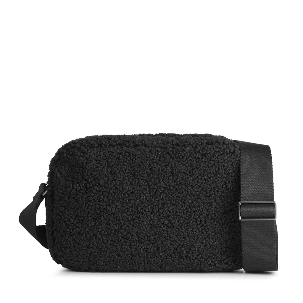 A Markberg Alexis MBG Crossbody Bag - Black, made from recycled plastic and featuring a vegan strap, is a sustainable choice.
