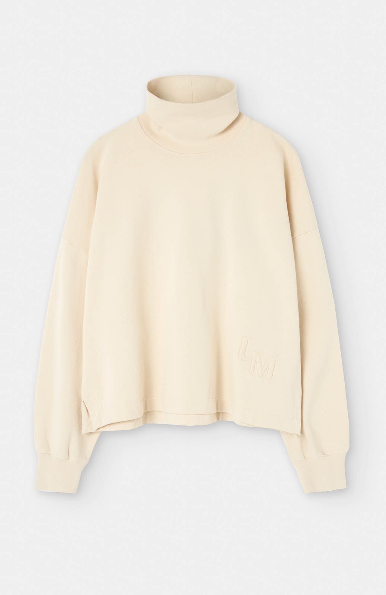 Introducing the Lise Sweatshirt - Natural by Loreak Mendian. This beige turtleneck sweater is made from organic cotton and features long sleeves. The "L M" initials are elegantly embroidered at the lower side, and its loose fit ensures added comfort.