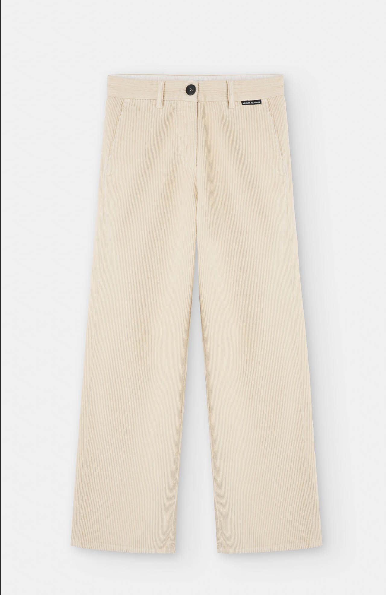 a flat product shot of cream cord trousers by loreak mendian