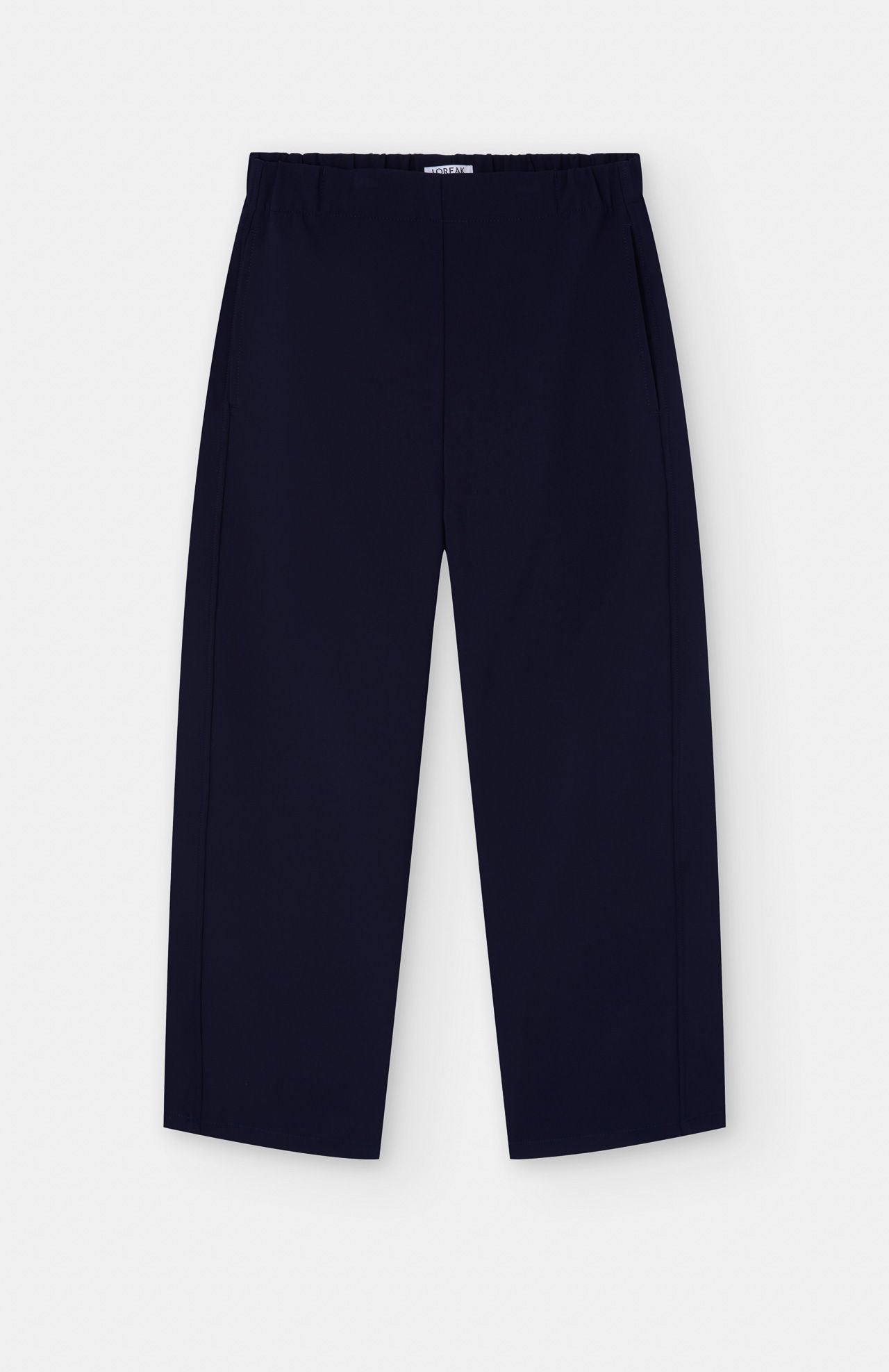 navy blue barrel shaped jogger trousers on a white background