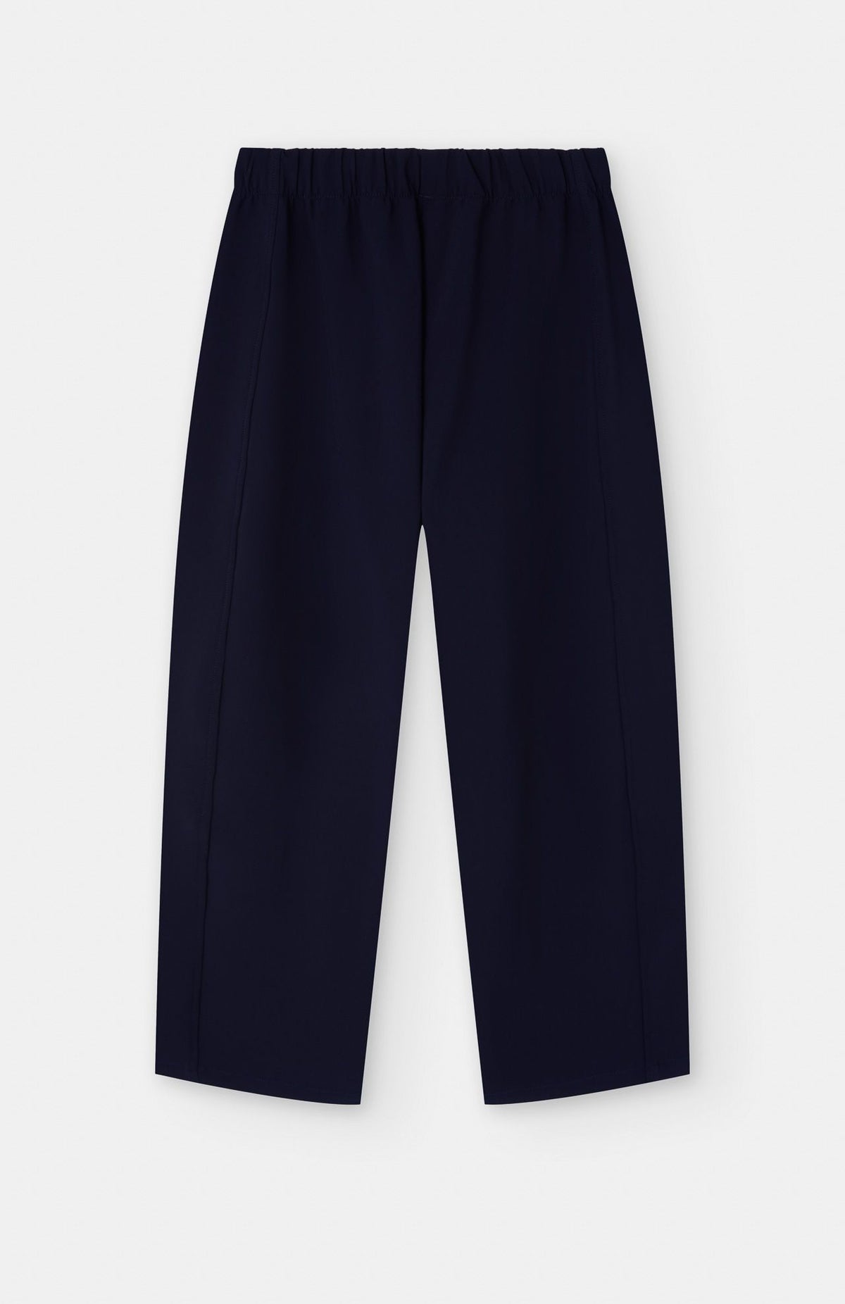 navy blue barrel shaped jogger trousers on a white background