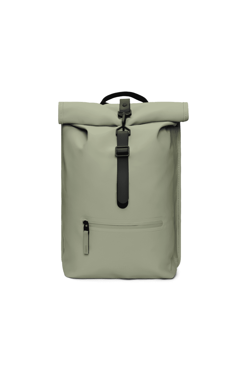 The Rains Rolltop Rucksack, in light green PU fabric, has a waterproof design with a black strap. It features a small front zippered pocket, side-access laptop pocket, and top handle for easy carrying.