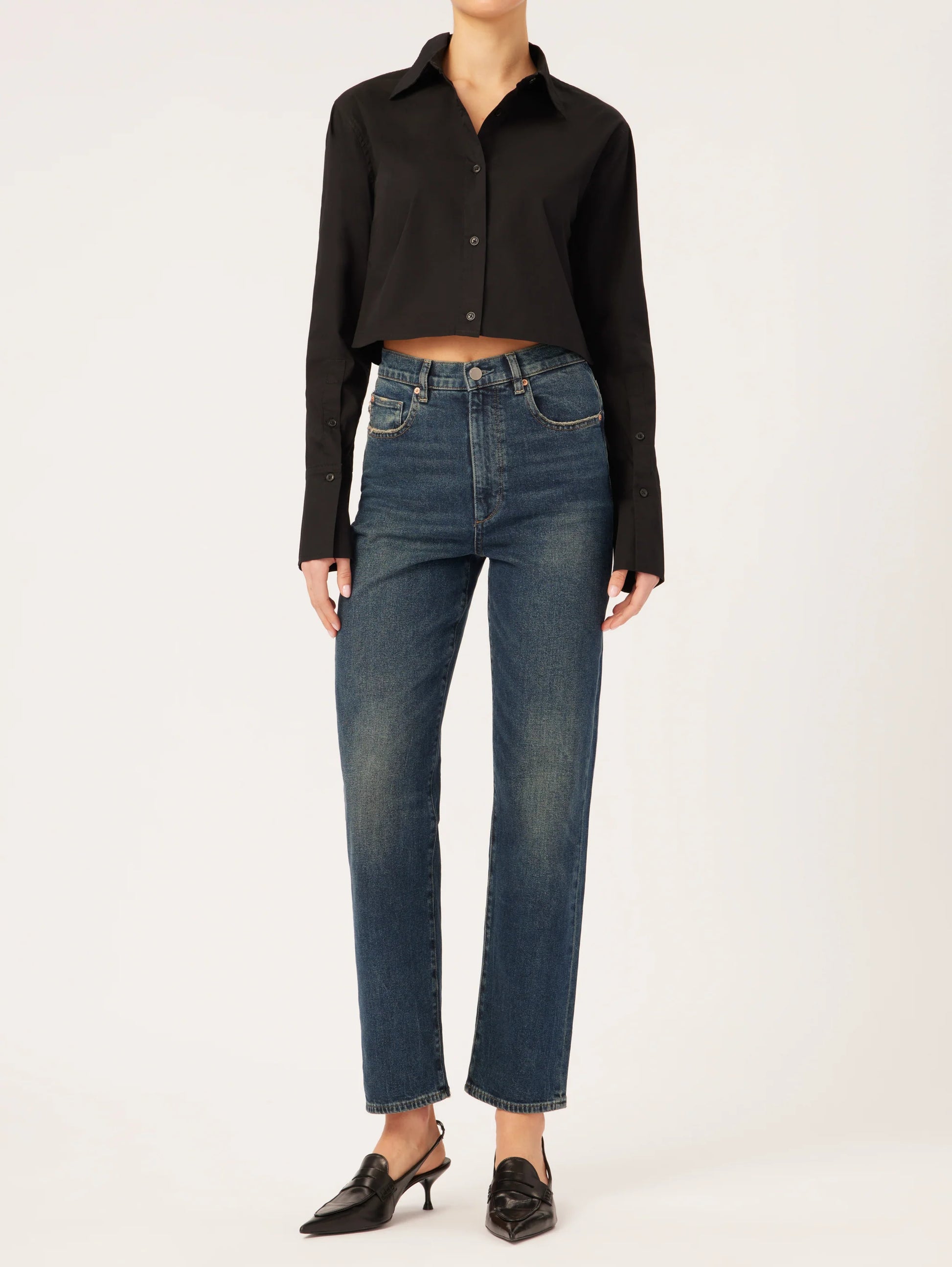 The model is wearing a black blouse and DL1961 Enora Cigarette High Rise - Broadbay jeans.