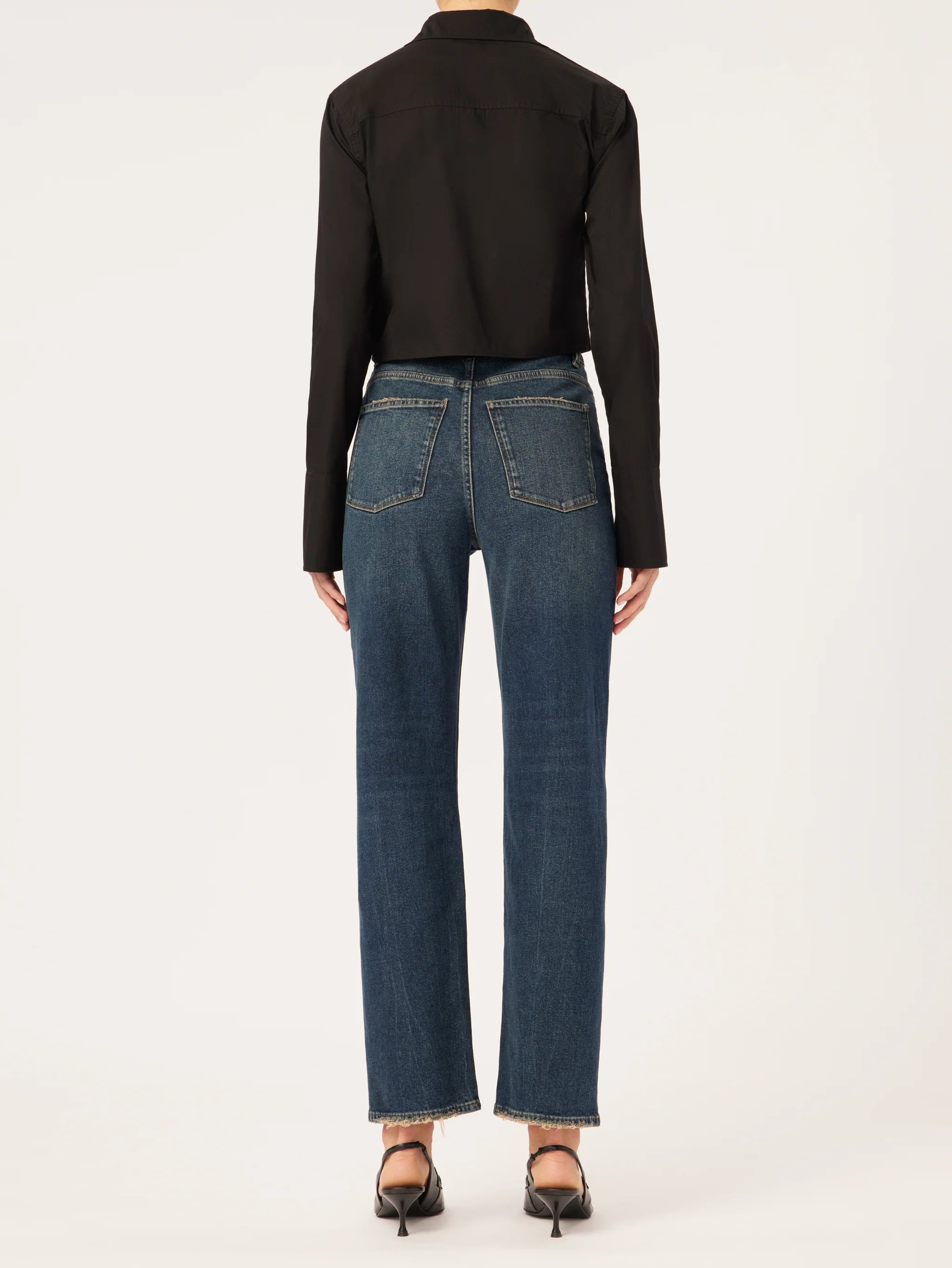 The back view of a woman wearing DL1961 Enora Cigarette High Rise - Broadbay jeans and a black shirt.