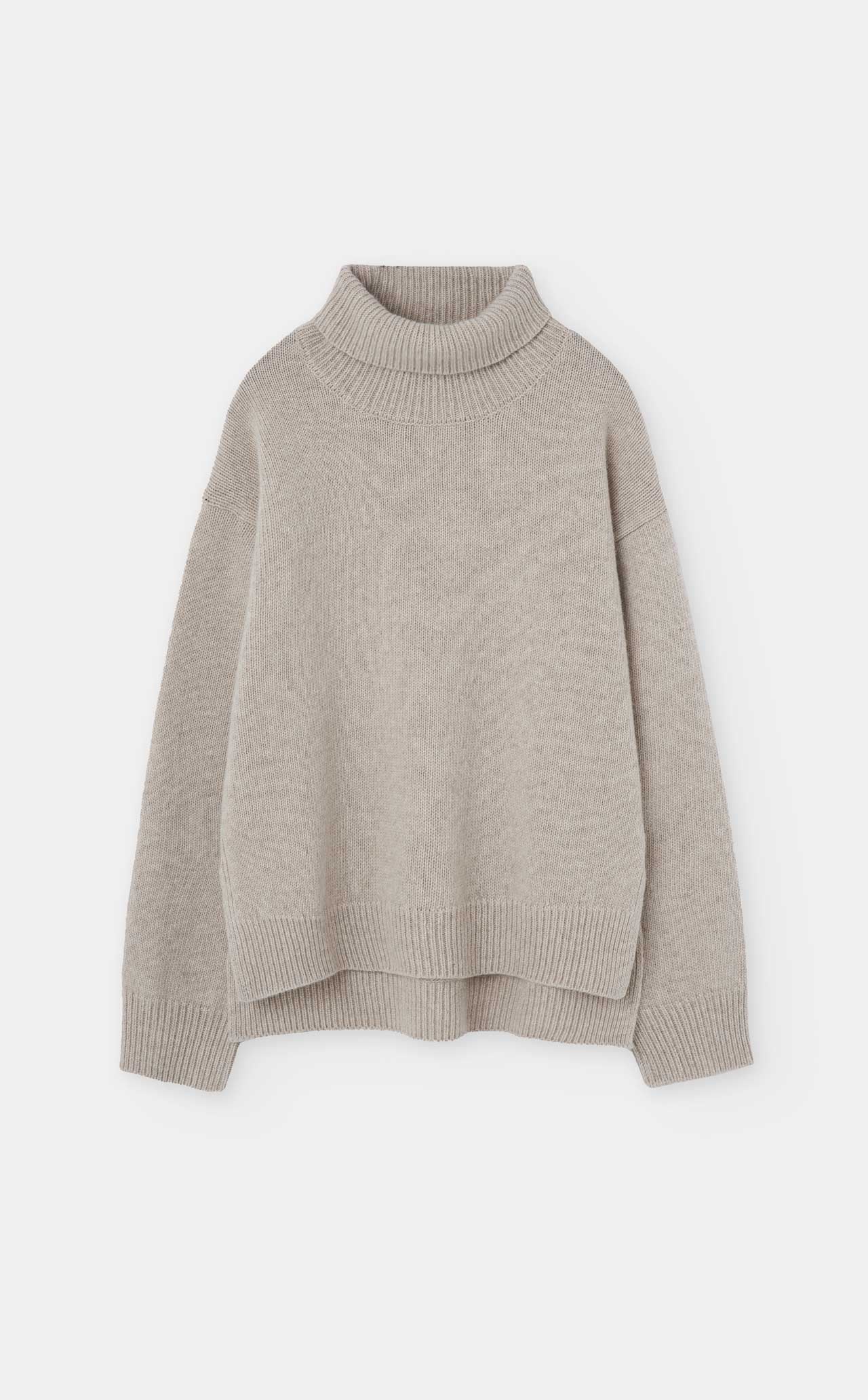 The Loreak Mendian Isla W jumper in Cool Beige is a long-sleeve wool sweater featuring ribbed collar, cuffs, and hem, shown on a plain white background.
