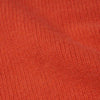 A close up of the wool material of the Isla W jumper in shade orange.
