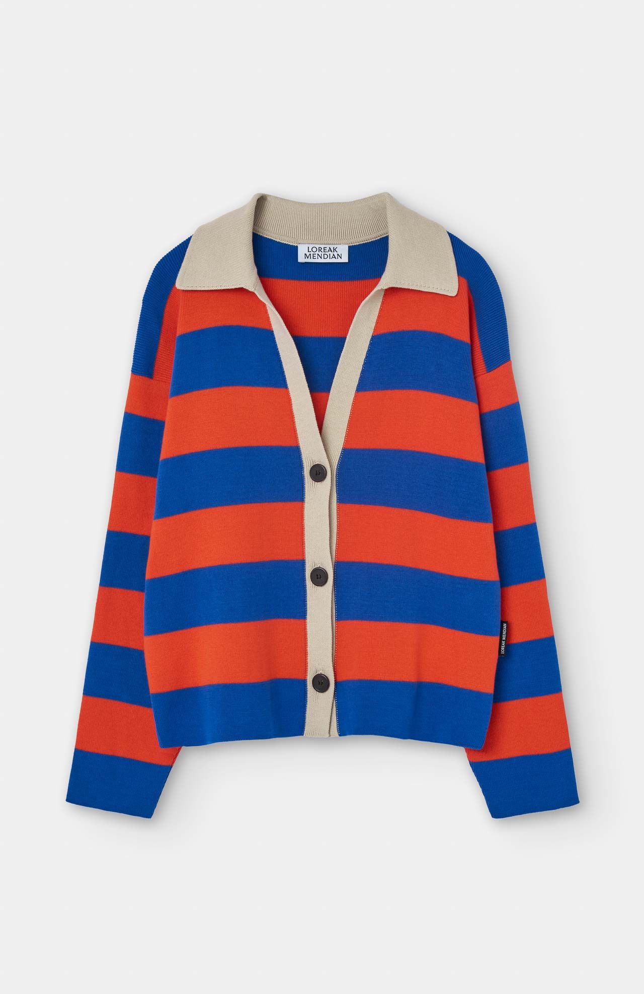 The Nikole Cardigan - Ink by Loreak Mendian showcases bold blue and orange stripes, crafted from organic cotton, with a button-up front and a classic shirt collar against a plain background.