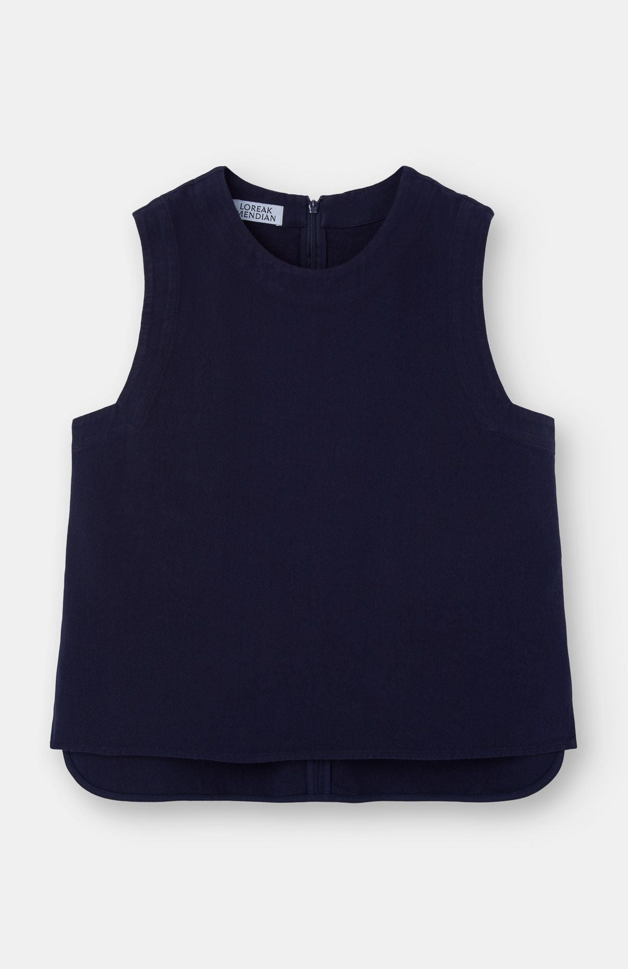 The Bera Sleeveless Top in navy by Loreak Mendian features a linen-cotton blend, round neckline, back zipper, and asymmetrical hem, shown laid flat on a white background.