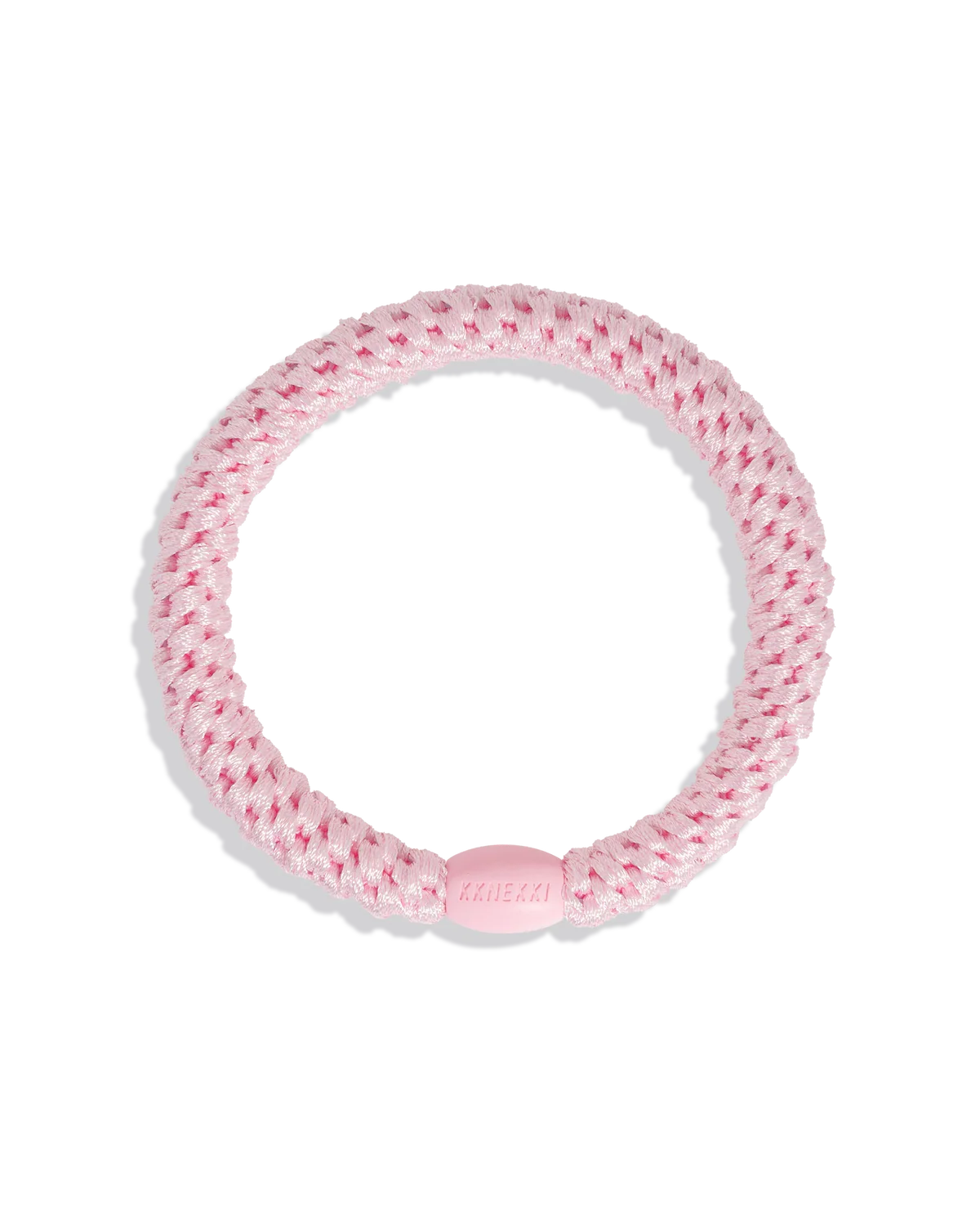 A pink braided Hair Tie - Original by KKNEKKI, featuring a gentle grip and small oval connector, is displayed on a plain white background.
