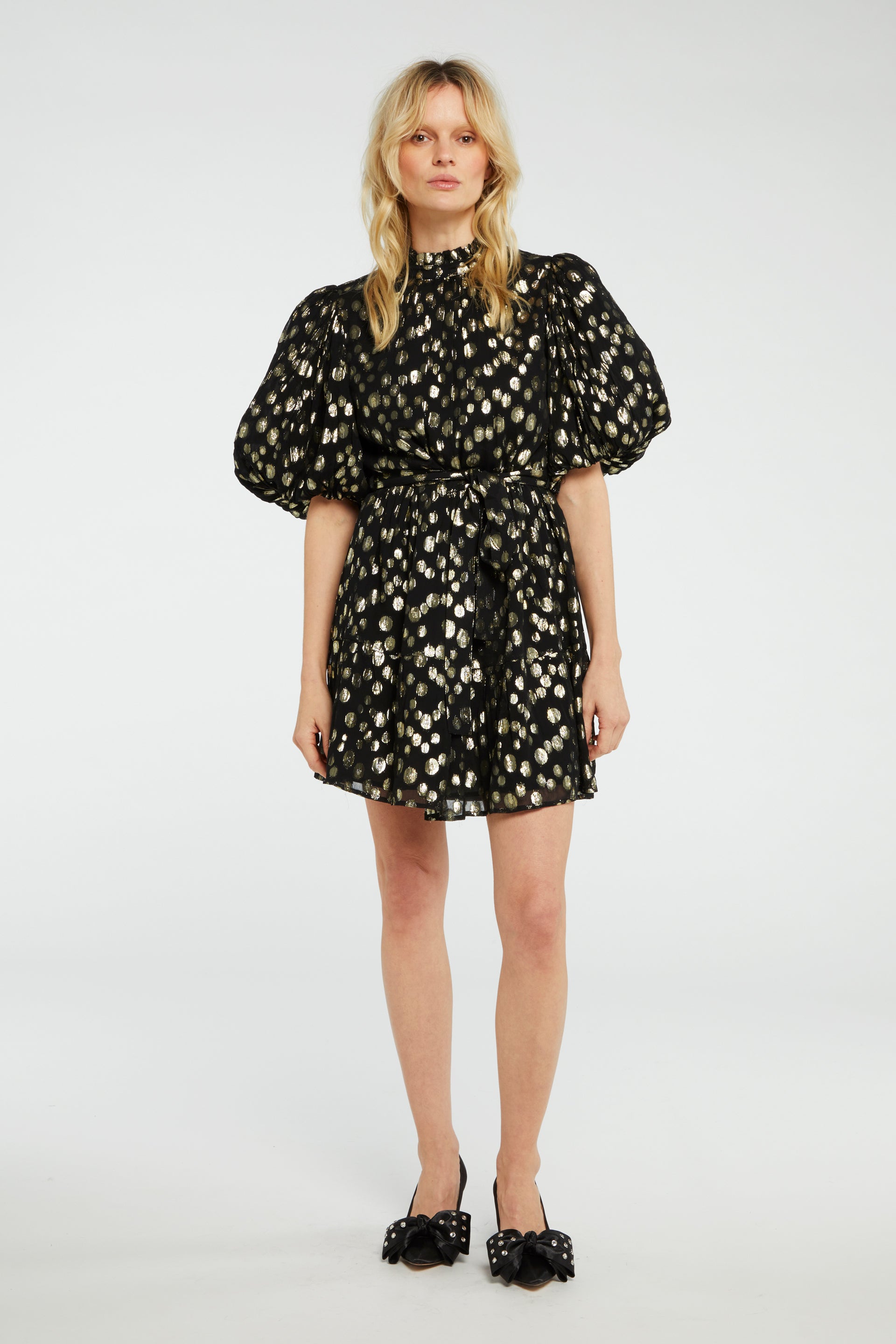 The model is wearing a Roxy Dress - Black & Gold by Fabienne Chapot with a floral print.