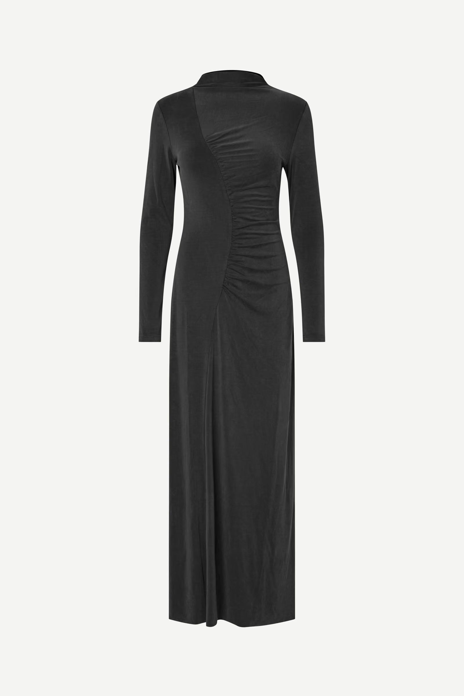 The Saandressa Is dress by Samsøe Samsøe is a long-sleeve black dress featuring a high neckline, ruched waist detailing, and an ankle-length hem, shown against a plain white background.