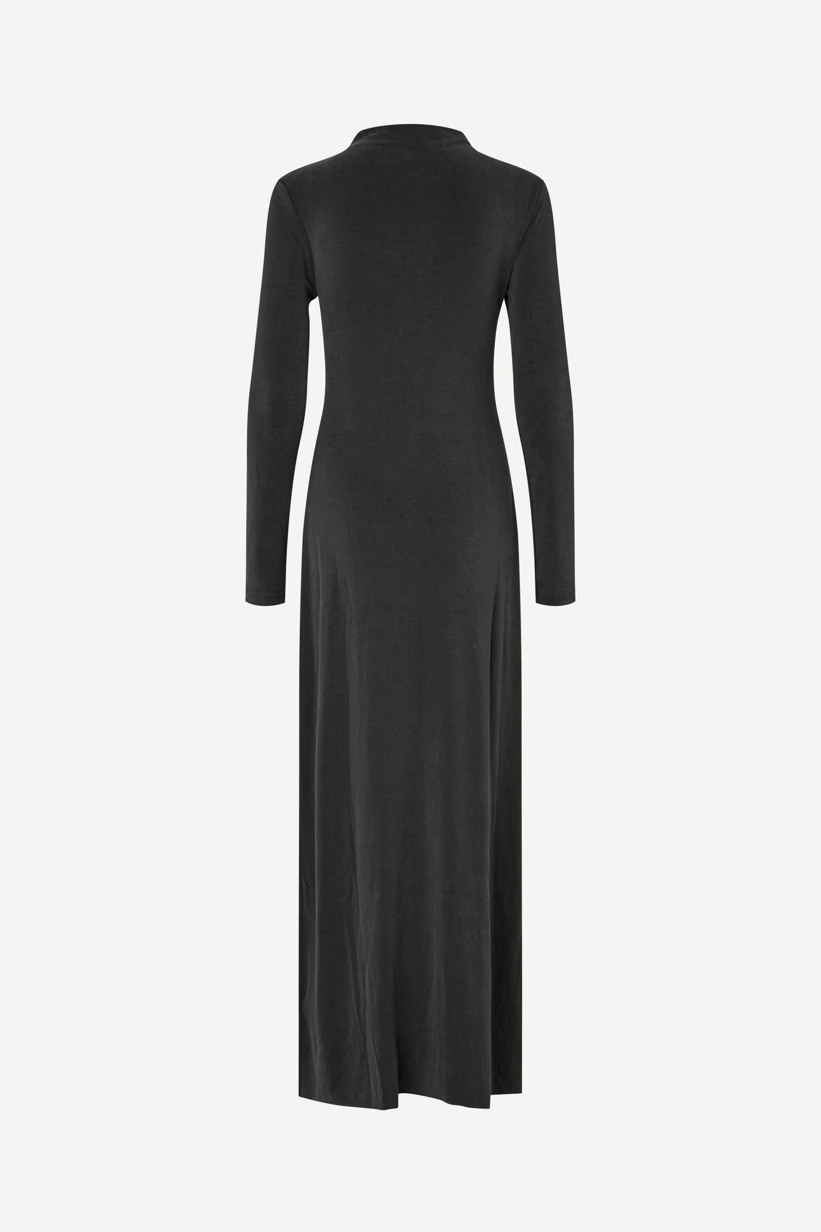 The Saandressa Is dress by Samsøe Samsøe is shown from the back against a plain white background. This black, ankle-length jersey maxi dress features long sleeves and subtle ruched detailing.
