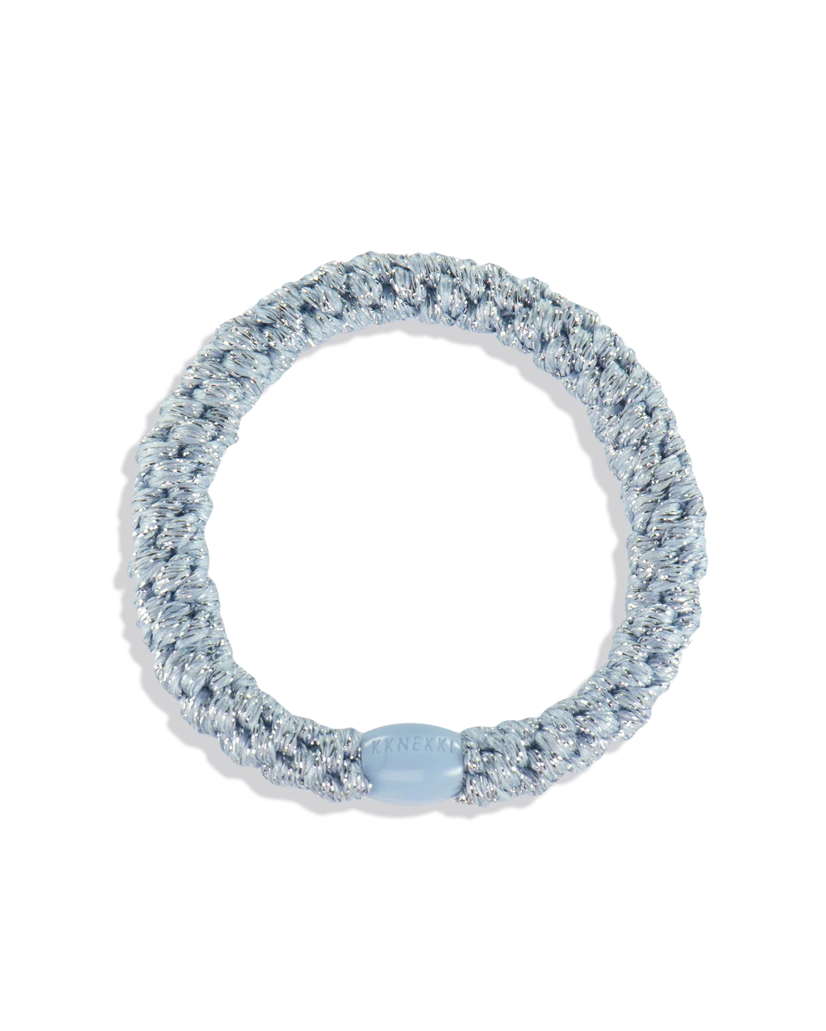 The KKNEKKI Hair Tie - Original is a silver, coiled hair accessory with a shiny metallic finish and a light blue clasp featuring embossed text. Its gentle grip ensures secure, waterproof hold for your hair.