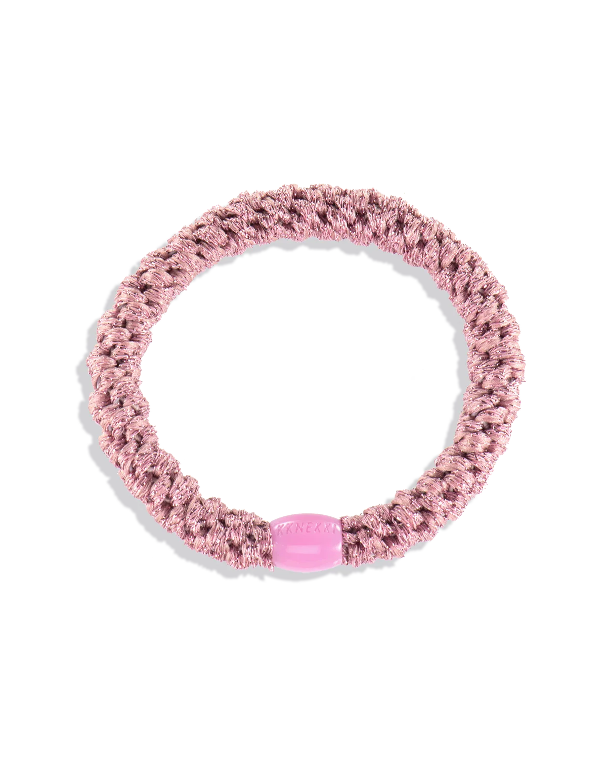 The KKNEKKI Hair Tie - Original in pink features a braided design with a small oval plastic bead, providing a gentle, waterproof grip for comfortable all-day wear.