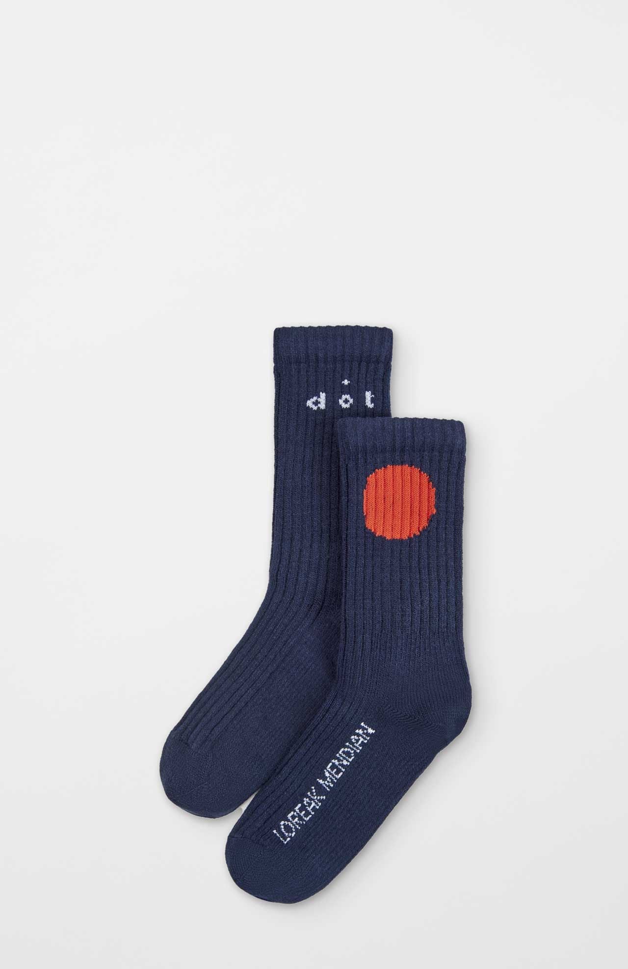 A pair of Bioti Mid-Calf Socks by Loreak Mendian in navy blue, featuring ribbed texture; one sock has a red circle, the other displays "LOCAL MEDIUM" in white text on the sole.