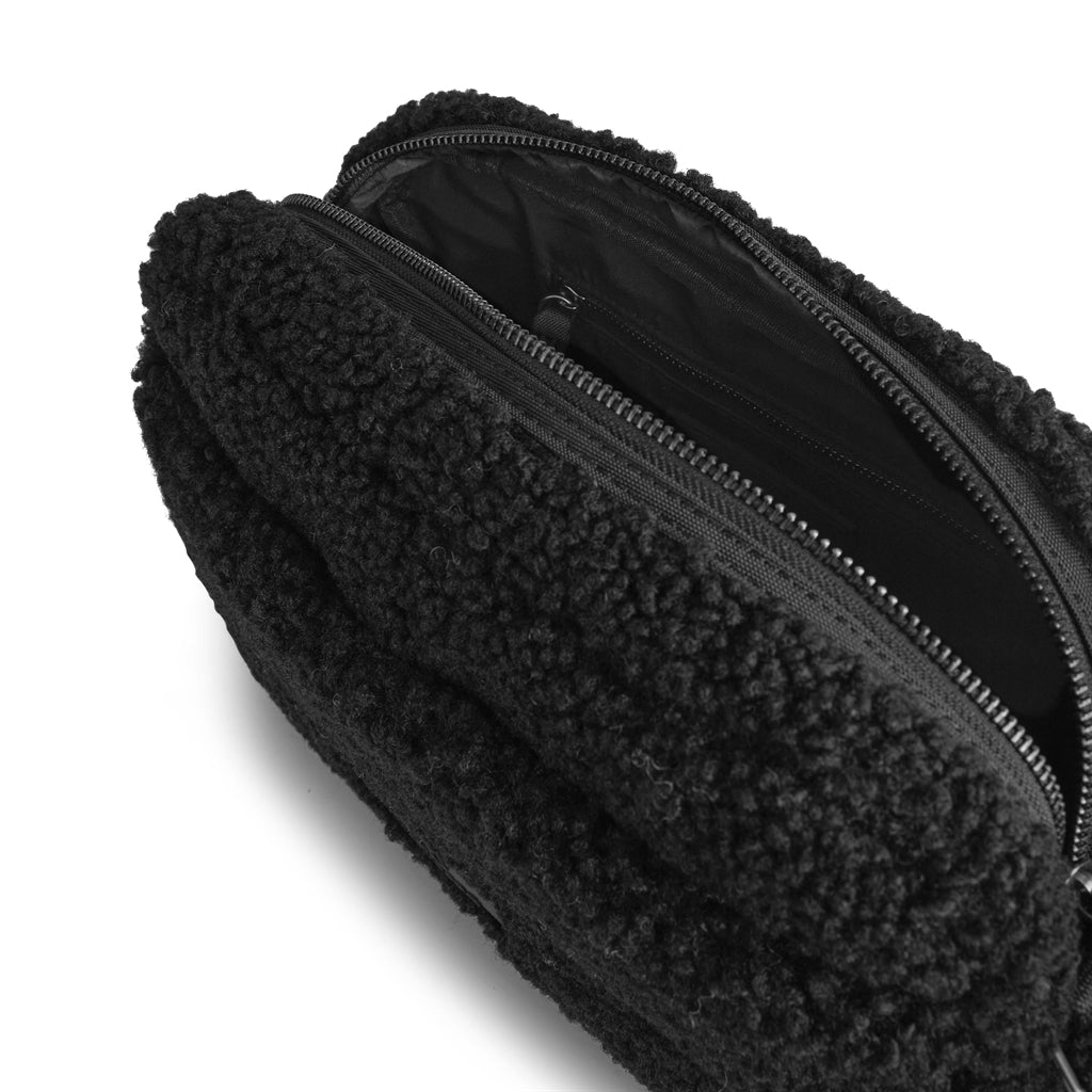 A sustainable Alexis MBG Crossbody Bag - Black with a zipper made from recycled plastic by Markberg.