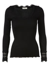 product shot of Rosemunde long sleeved black ribbed top wit lace trims, back view