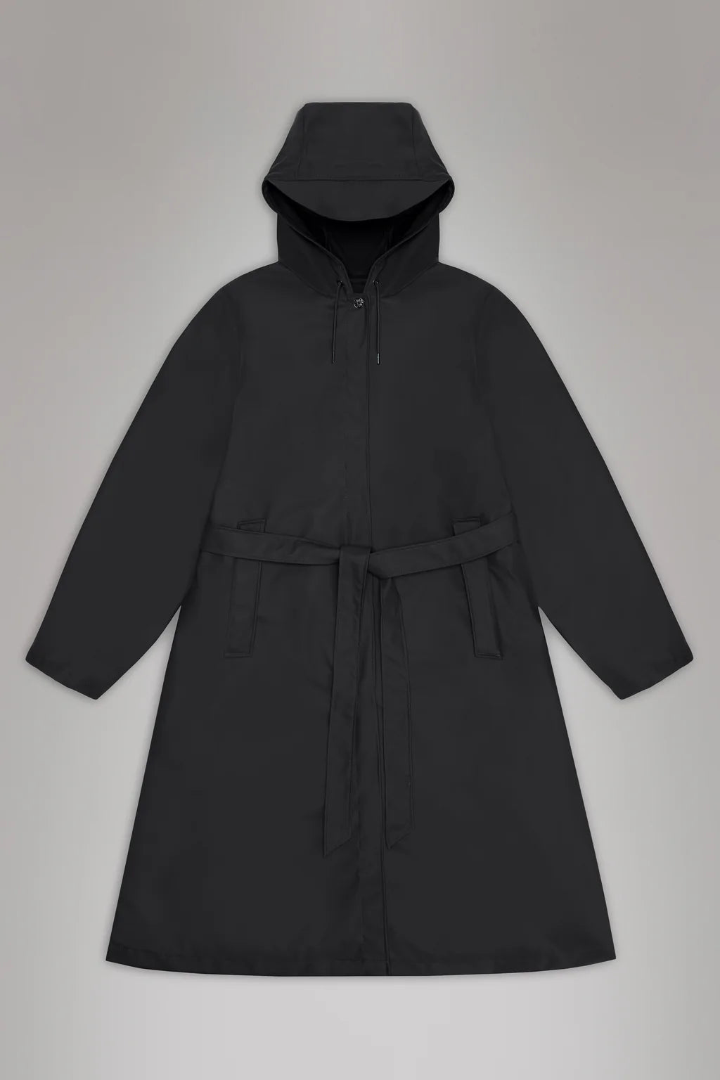 The A-Line Longer W Jacket by Rains is a black hooded trench coat with a waist belt, displayed on a gray background.