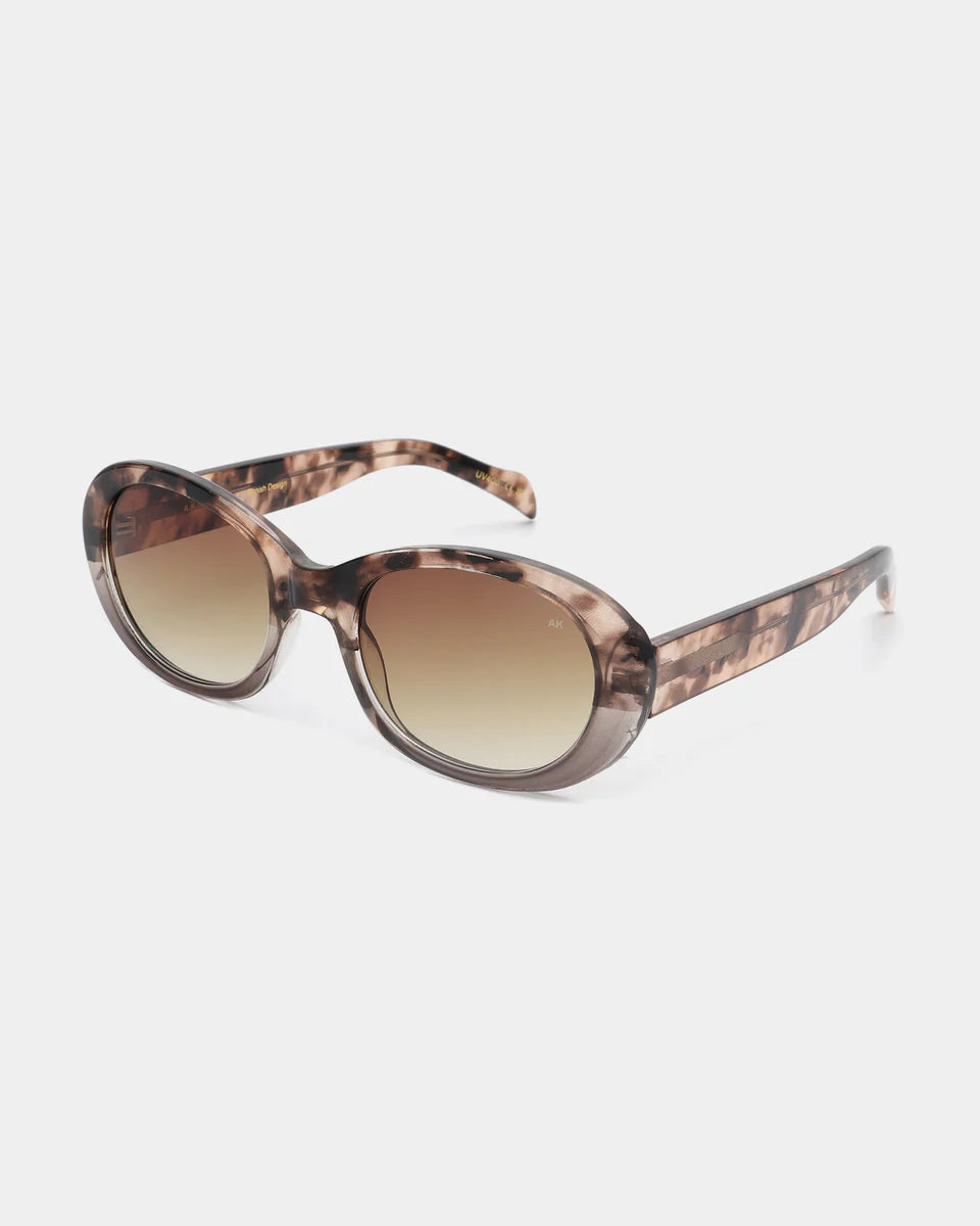 The Anma Sunglasses - Coquina / Grey Transparent by A. Kjærbede feature UV400 protection and gradient lenses, crafted from recycled materials and shown on a white background.