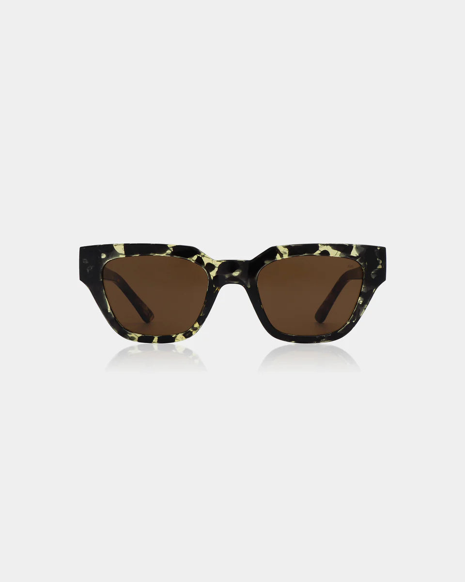 The A. Kjærbede Kaws Sunglasses in Black/Yellow Tortoise feature a rectangular eco-friendly frame, dark brown lenses with UV 400 protection, and are displayed on a plain white background.