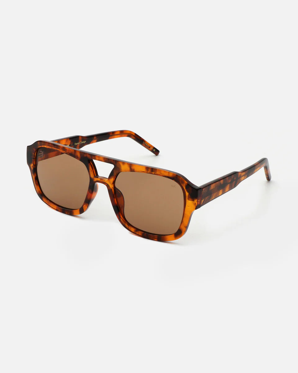 The Kaya Sunglasses - Havana by A. Kjærbede feature a tortoiseshell rectangular frame, brown UV 400 lenses, and eco-friendly materials, displayed on a plain white background.