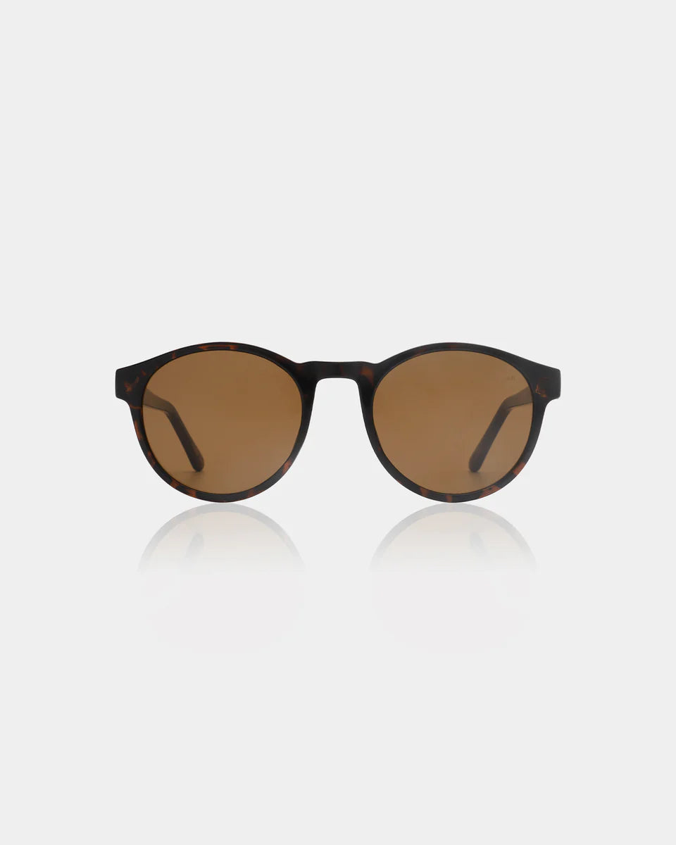 A. Kjærbede Marvin Sunglasses - Demi Tortoise: round unisex frames with brown tinted lenses, made from recycled materials, shown on a plain white background.