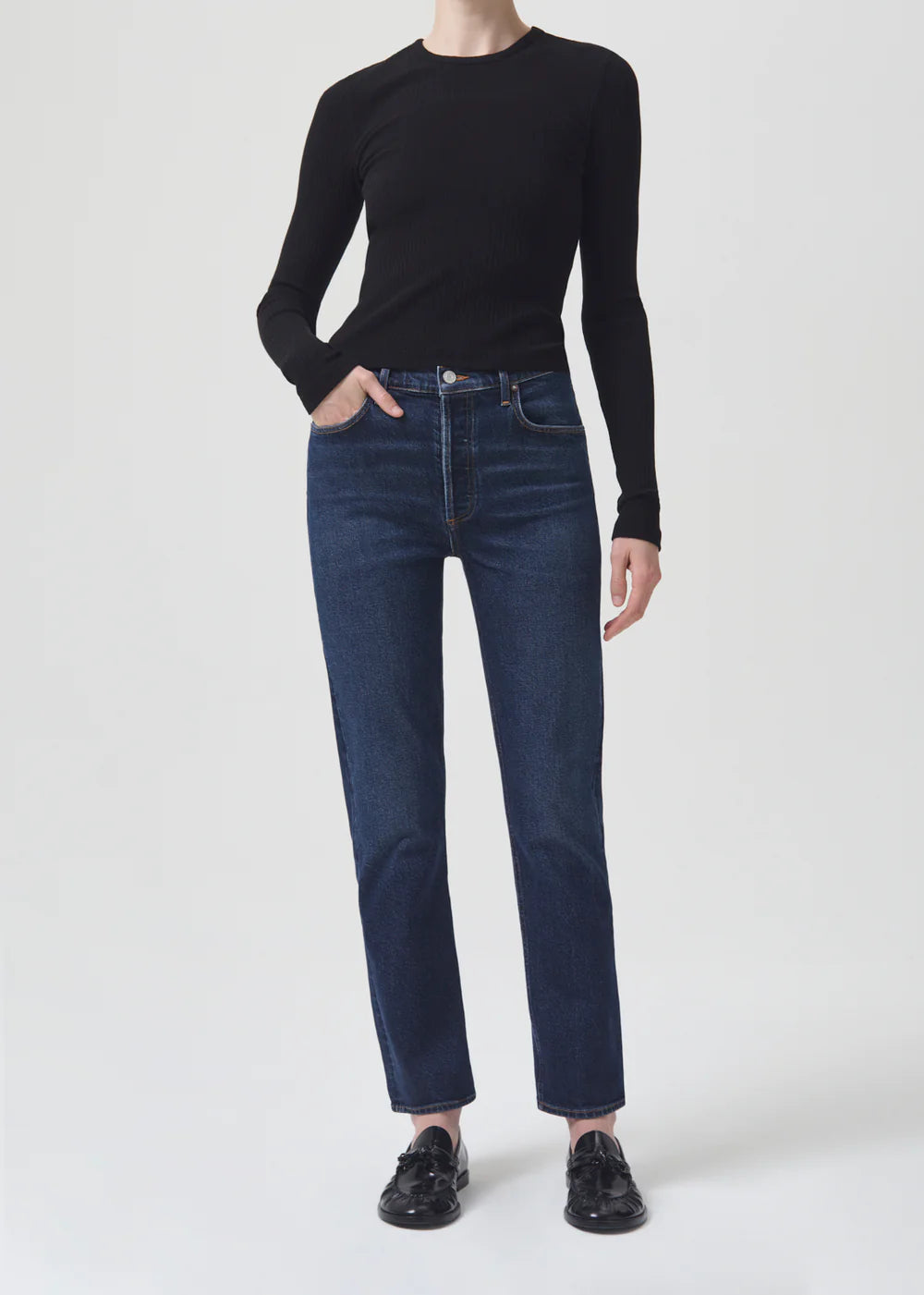 The model is wearing Riley Straight Long - Divided jeans by AGOLDE.