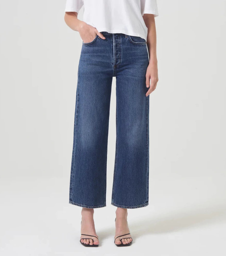 model wears blue wide leg jeans
