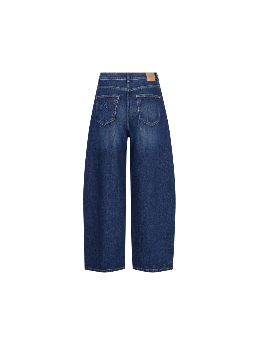 Back view of MOS MOSH Cindy Draciel Jeans in blue denim, featuring a high-rise barrel-leg silhouette, two rear pockets, and a tan patch on the waistband, displayed on a plain white background.