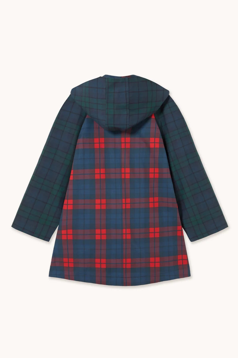 The Check Hood Trench Coat by Tiny Big Sister showcases a green and blue plaid pattern on the sleeves and hood, contrasted with a bold red, blue, and green plaid design on the back. This oversized coat blends eye-catching style with comfort, making it standout outerwear for any wardrobe.