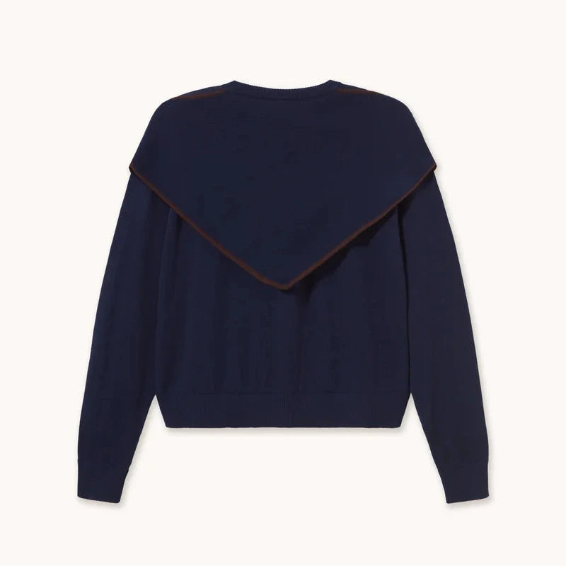The Tiny Big Sister Scarf Neck Lara Cardigan in navy features long sleeves and a wide, triangular scarf neckline draped over the shoulders, displayed against a plain background.