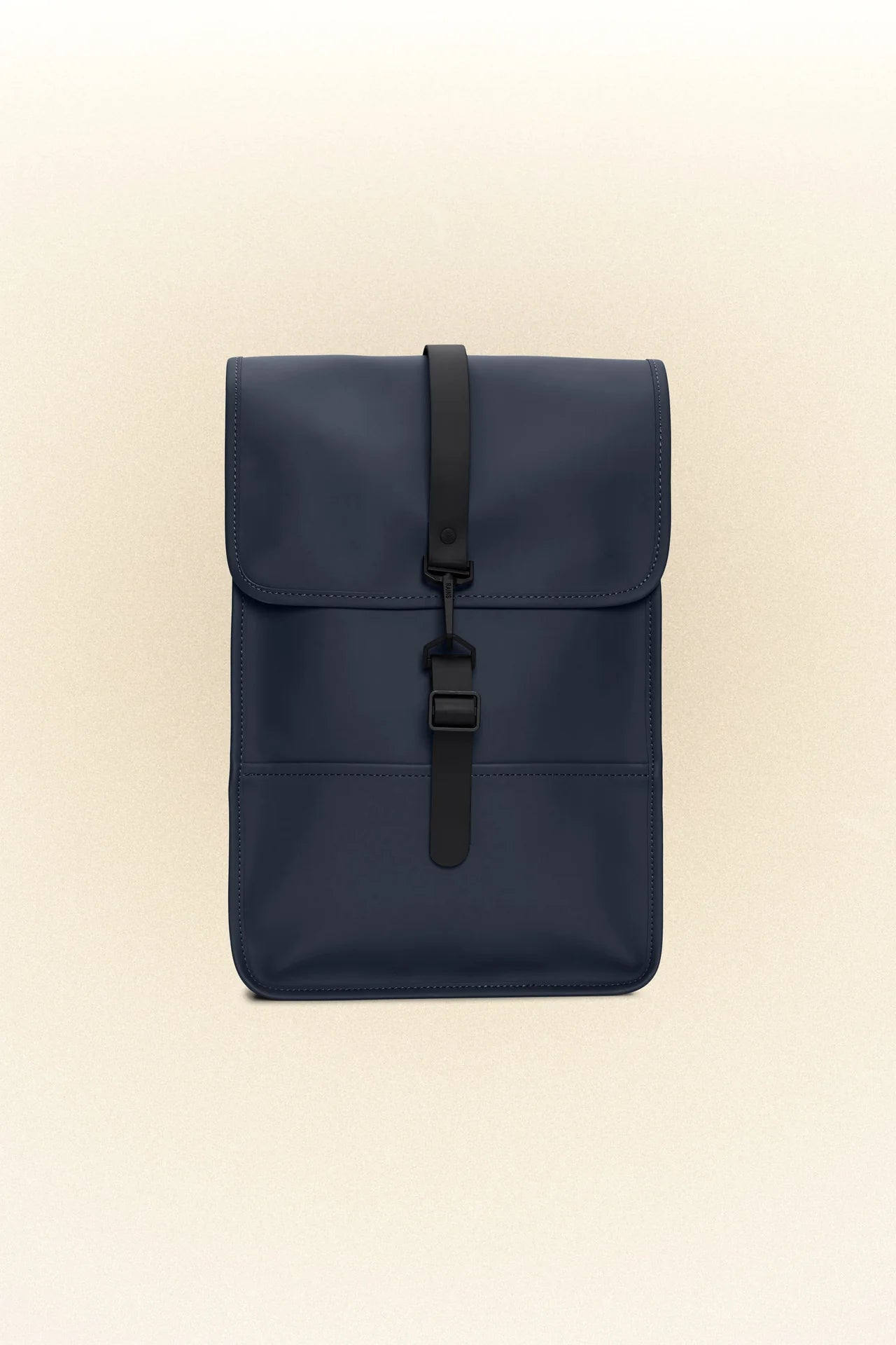 A small blue Rains Backpack Mini with black straps, perfect for carrying essentials.