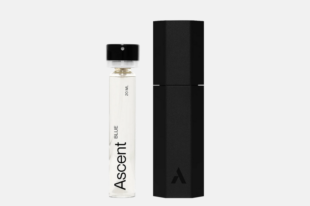 A 20 ml glass vial of Ascent Starter Pack - Blue with a black cap, standing next to its black cylindrical carrying case.