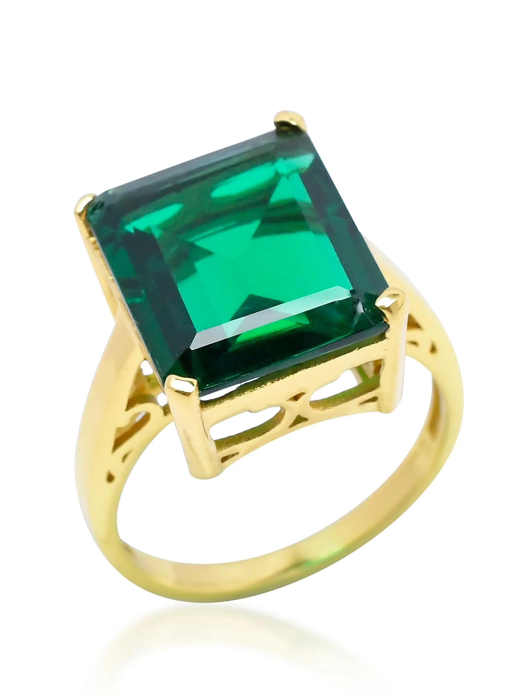 The SHYLA - Claudia Ring - Gold showcases a stunning emerald cut stone set in lustrous yellow gold, exuding a vintage look.