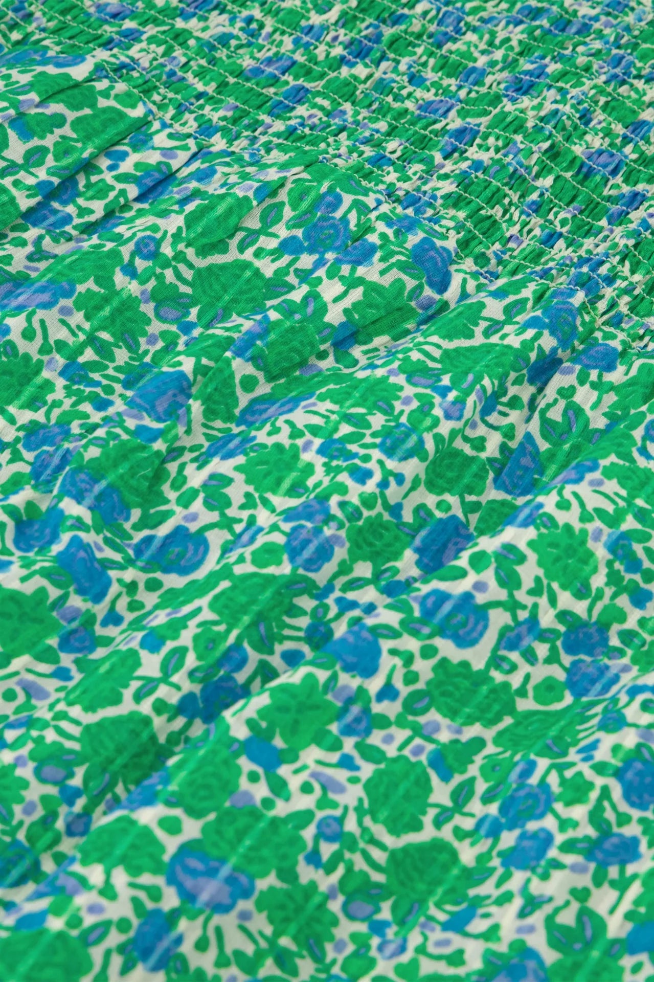 A close-up of a June Short Sleeve Organic Top in Green Clueless, made from organic cotton by Fabienne Chapot.