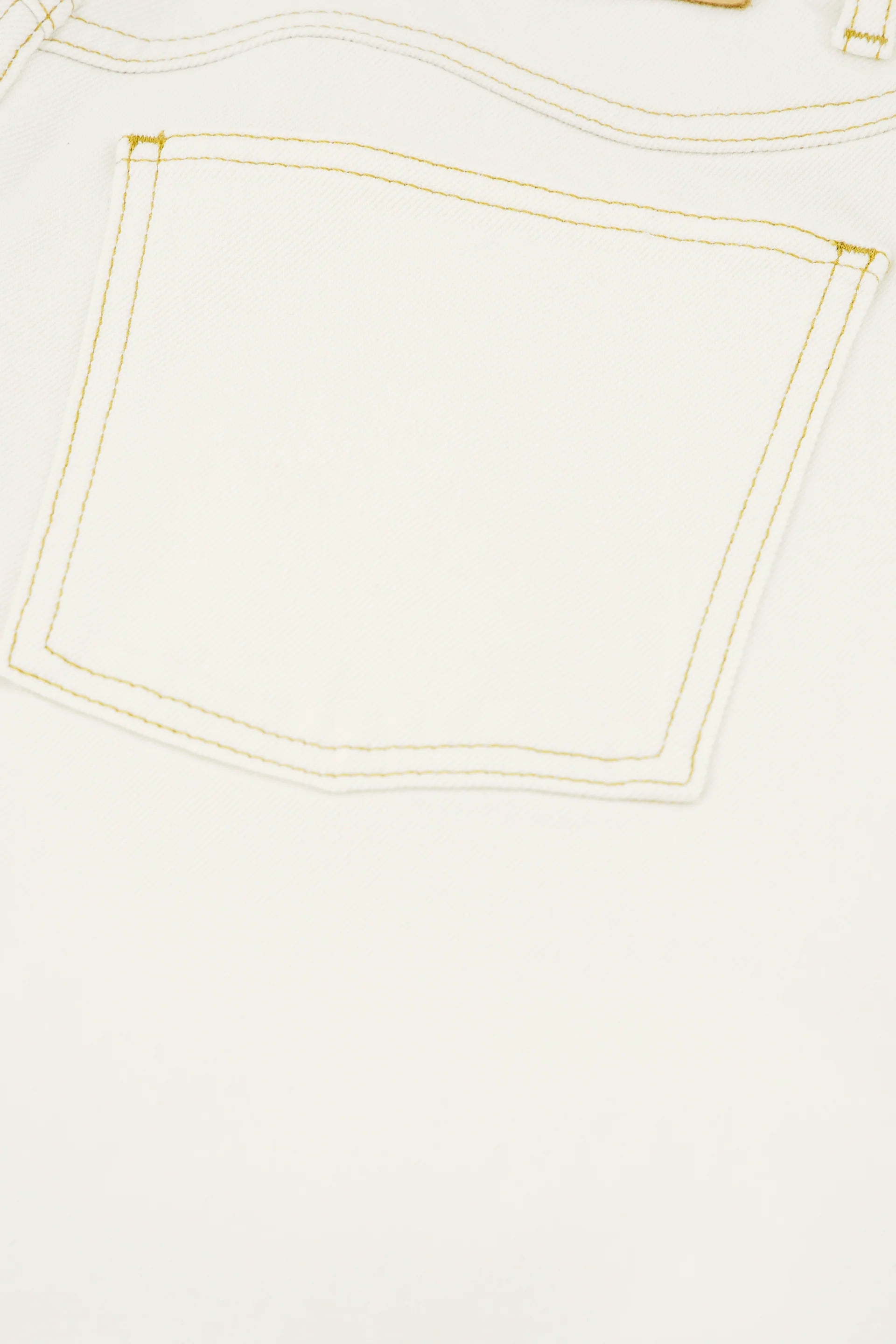 Close-up of the back pocket on Fabienne Chapot's Betty Barrel Jeans in white, featuring yellow stitching and crafted from organic cotton.