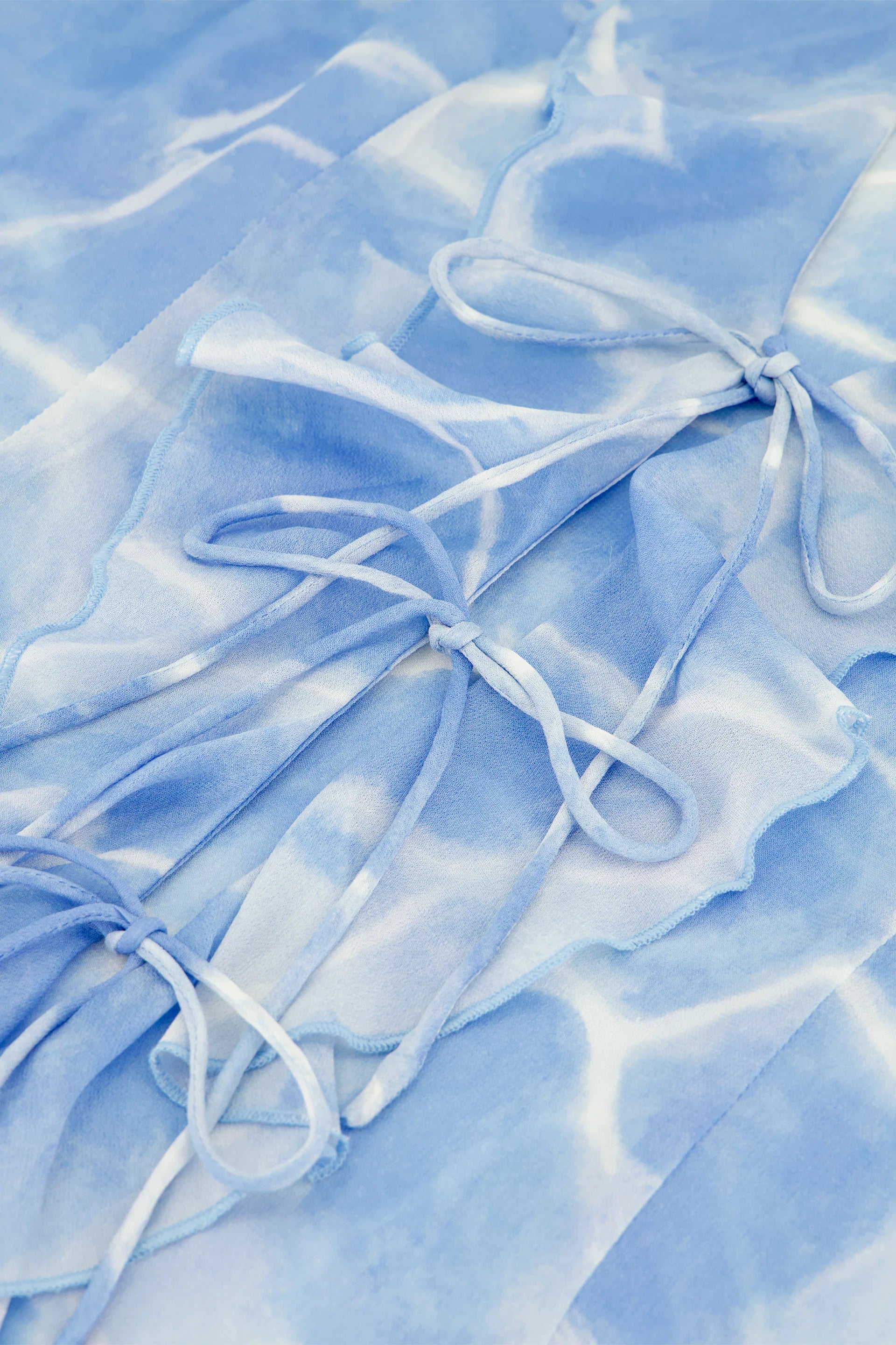 Close-up of light blue fabric with ruffled texture