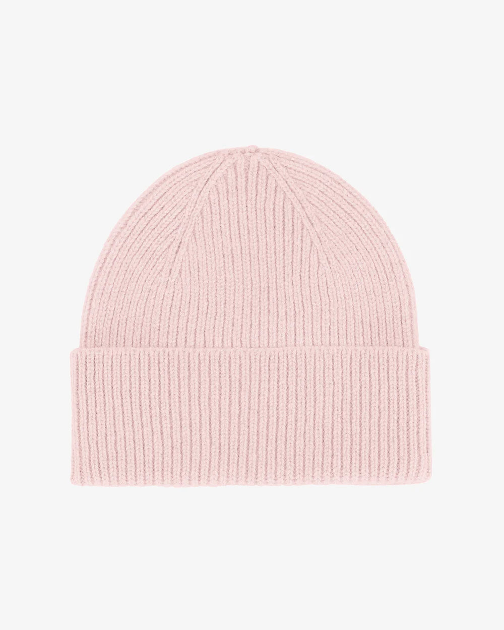 The Colorful Standard Merino Wool Beanie, in light pink with a ribbed knit and single fold design, is made from breathable fibres and displayed against a plain white background.