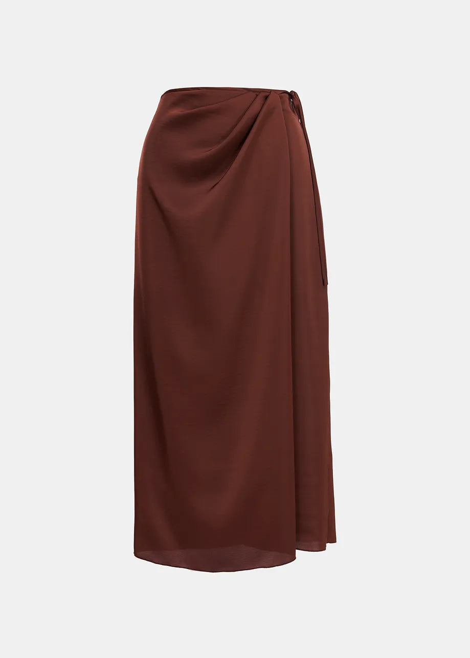 An Ellie Skirt - Brown by Essentiel Antwerp with a bow on it.