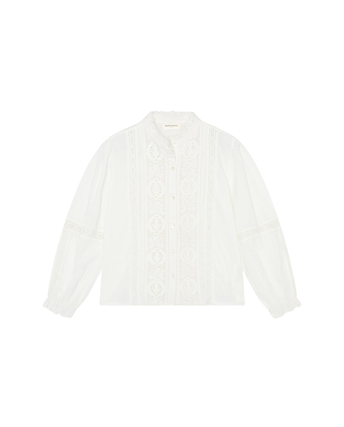 A white Emanuelle Blouse by Maison Hotel, featuring lace accents, long sleeves, and a high collar.