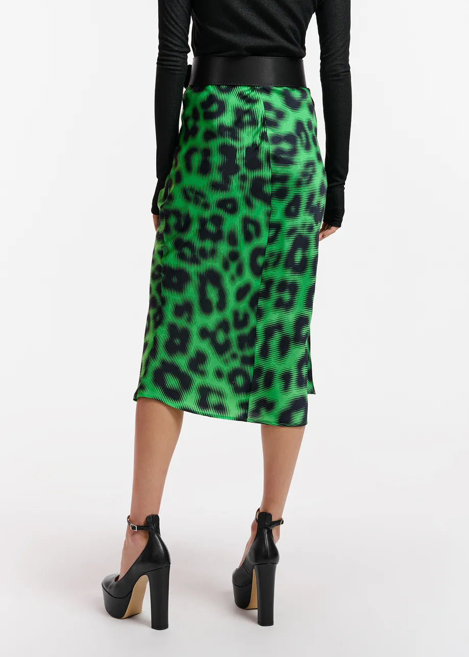 The back view of a woman wearing the Essentiel Antwerp Everest Skirt - Green made from recycled polyester-blend fabric.