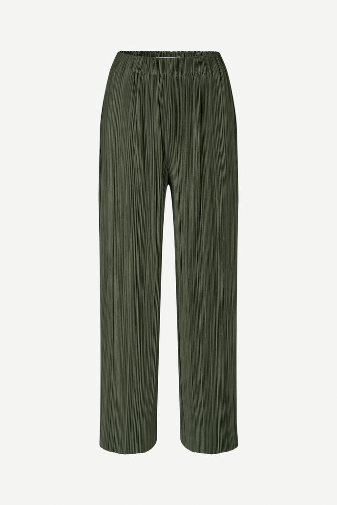 Forest Night Uma Trousers from Samsøe Samsøe, featuring a green shade, pleated wide-leg design, and crafted from recycled polyester with an elastic waistband.