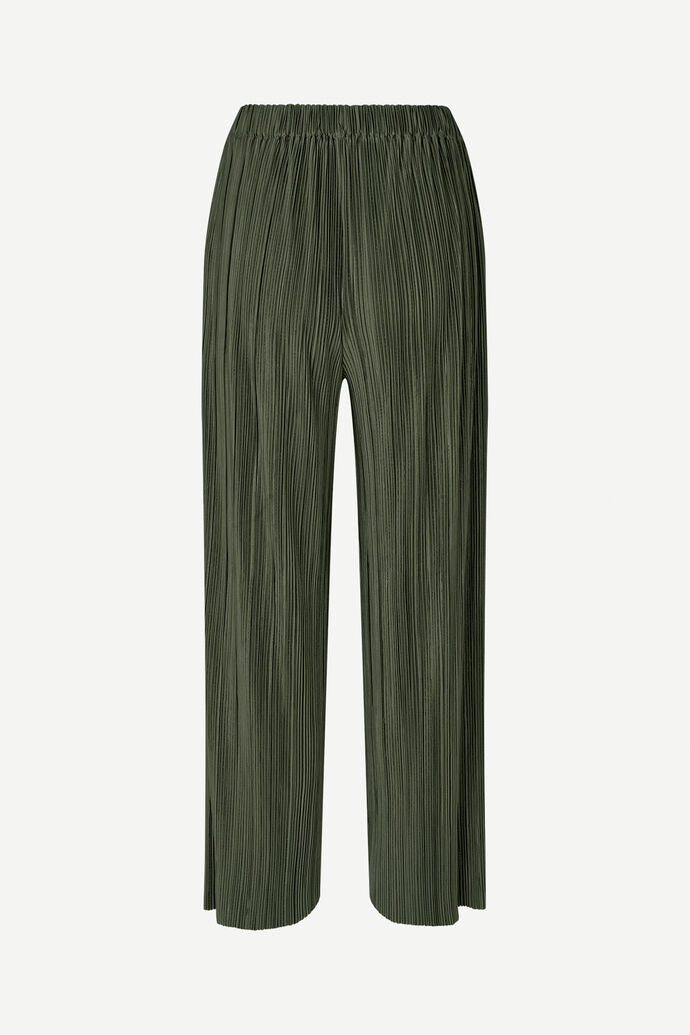 A pair of Uma Trousers - Forest Night by Samsøe Samsøe, featuring an olive green color, wide-leg design, and made from pleated jersey with an elastic waistband, shown on a plain background.