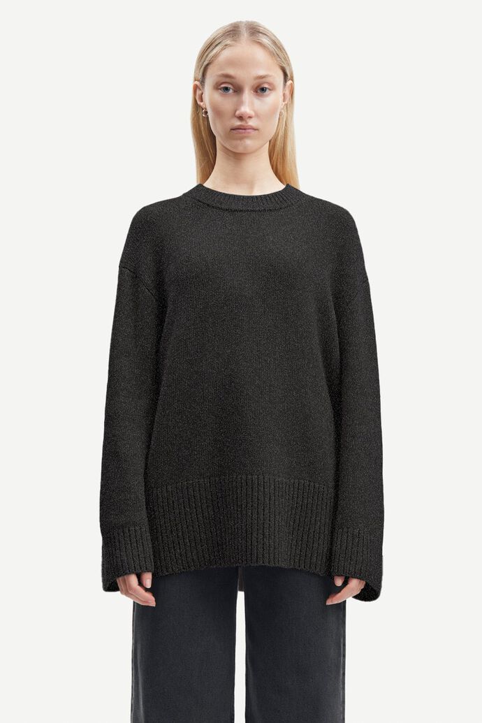 A woman wearing an Eliette Crew Neck - Phantom made from a wool and recycled polyester blend yarn by Samsøe Samsøe.