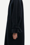 Close up of large cuffed sleeves.