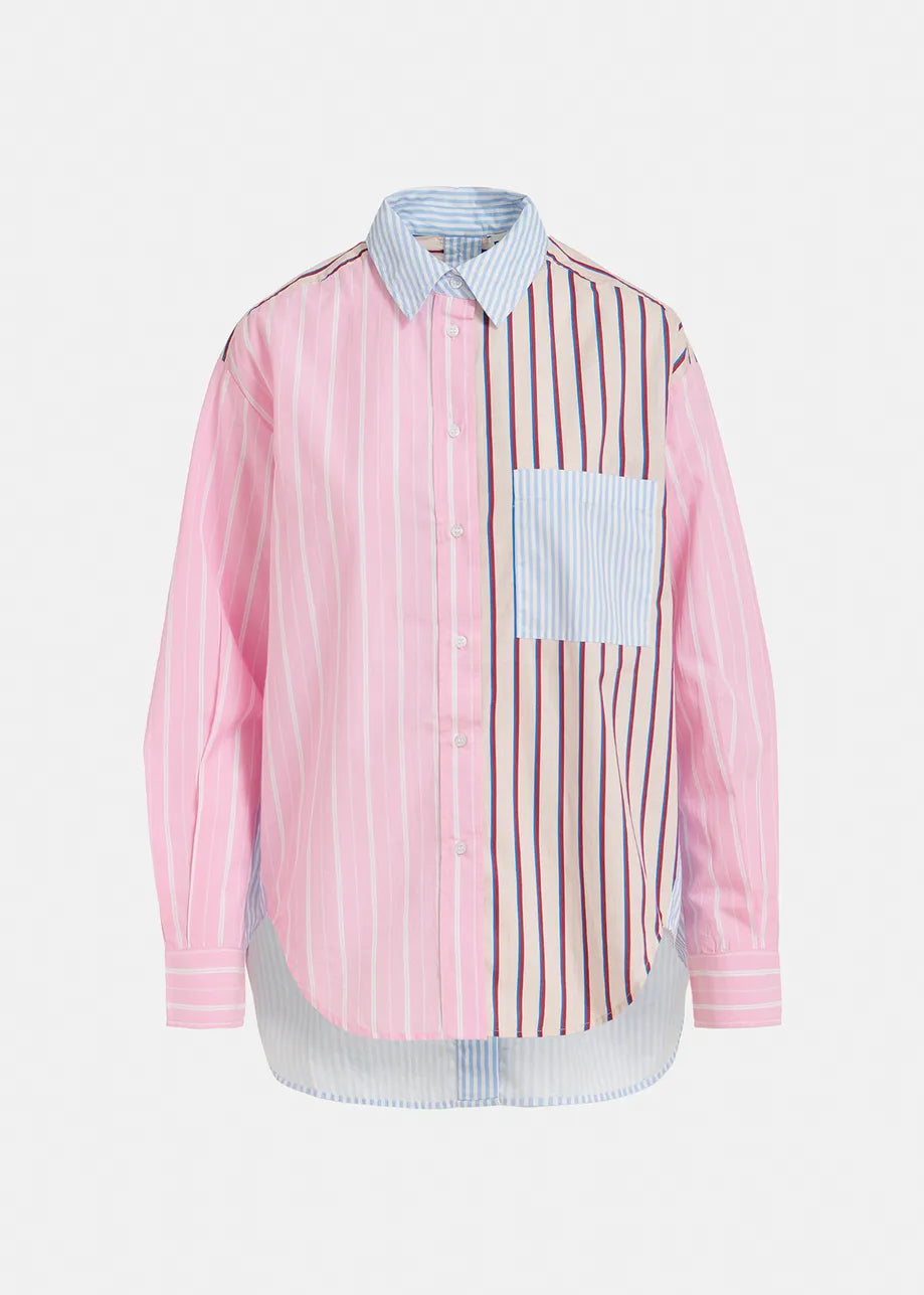 Model wears striped shirt in pink, blue, red and beige